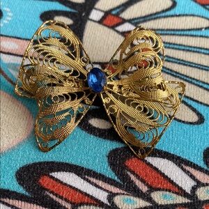 Vintage 1950 Elegant Gold Filigree Bow Brooch with Blue Accent